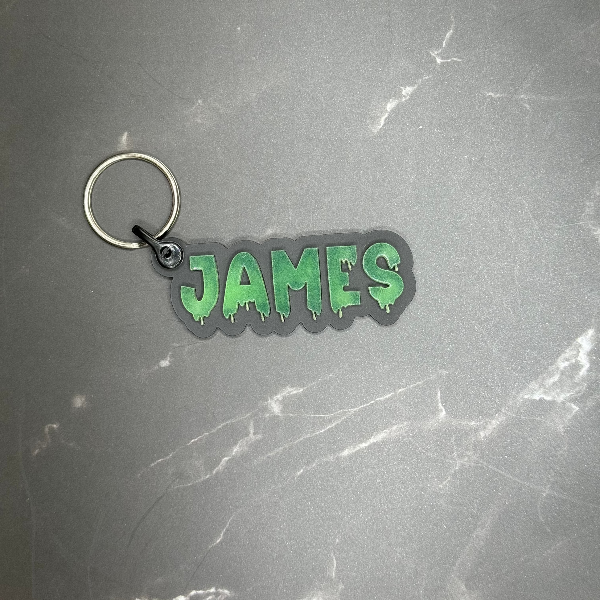 Glow in the dark "James" keychain